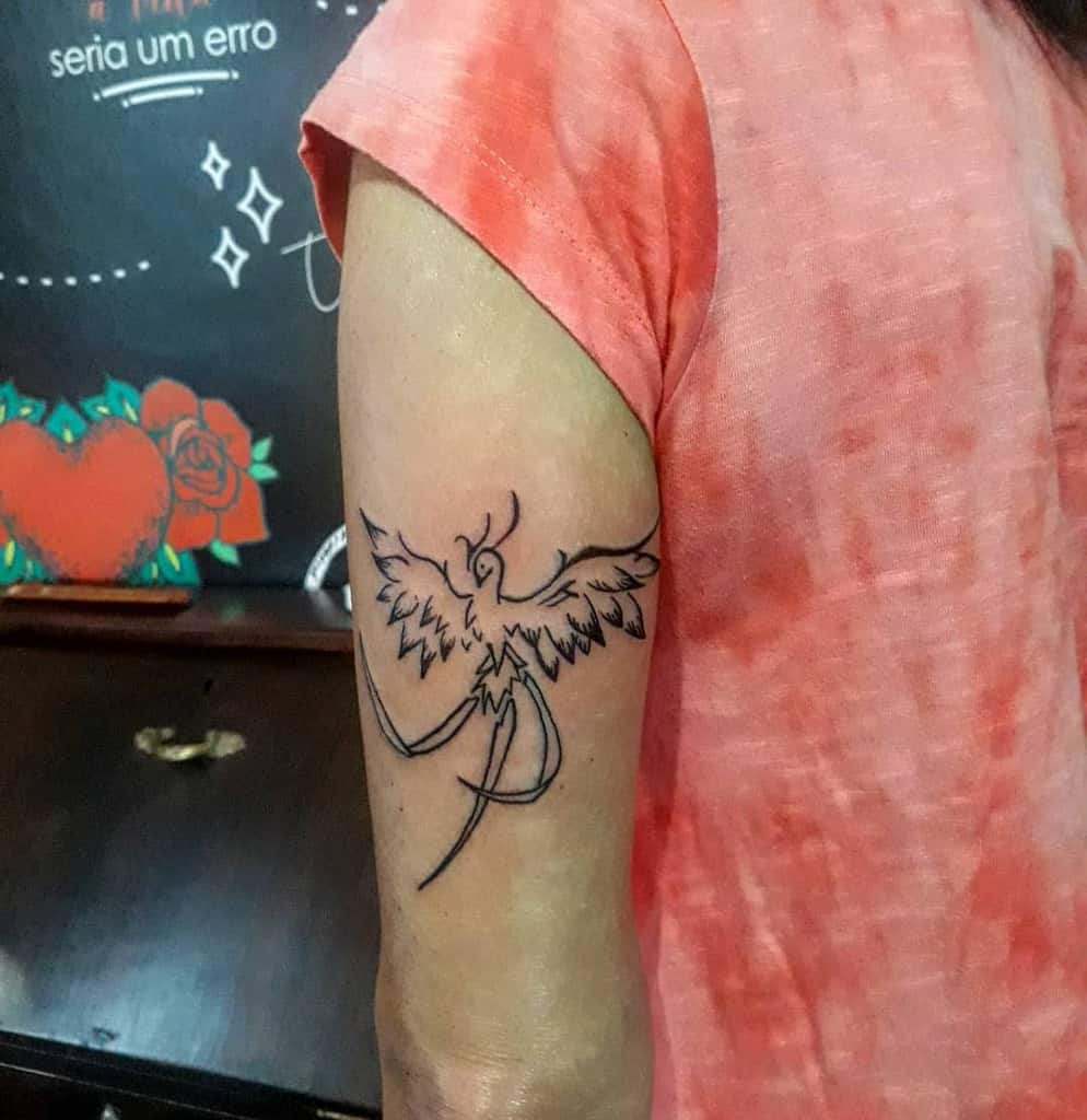Linework phoenix tattoo on the upper arm of a man