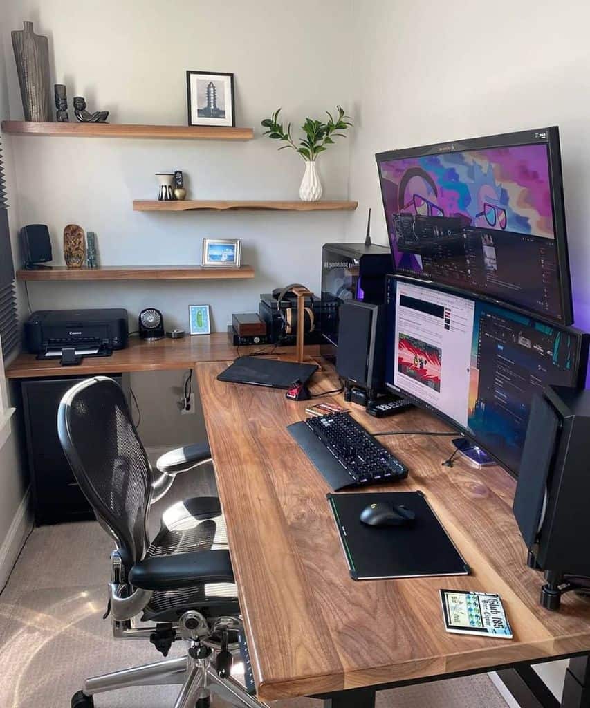 A modern home office setup with dual monitors, ergonomic chair, wooden desk, and shelves with decor and plants