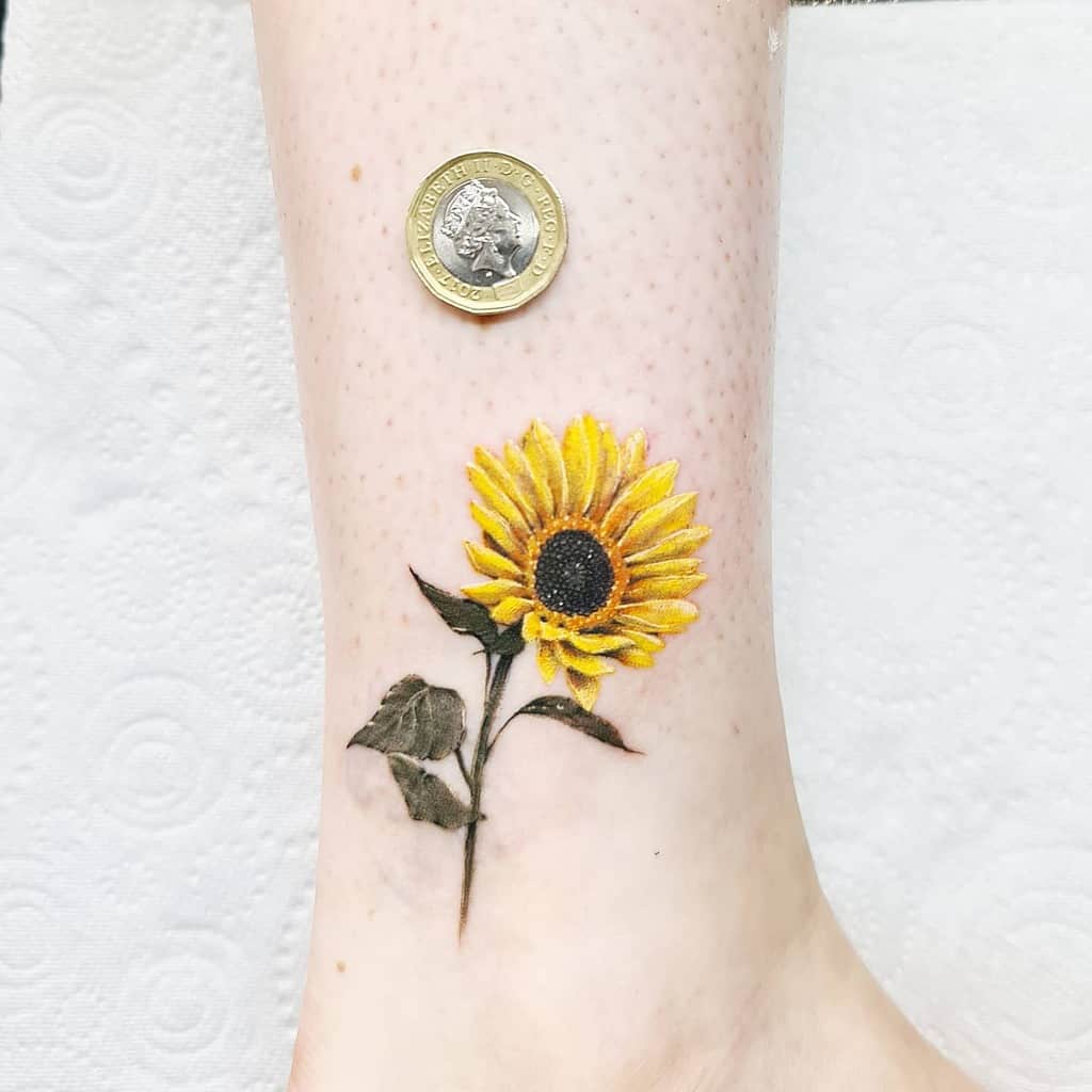 Sunflower tattoo on an ankle