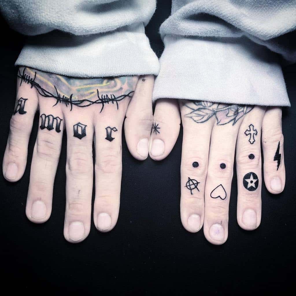 Hands with various finger tattoos, including symbols and a barbed wire design