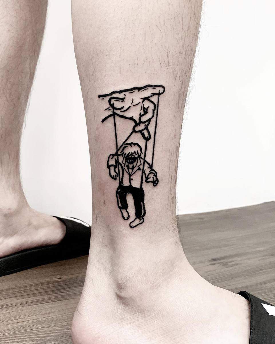 Minimalist leg tattoo of Kaneki Ken from Tokyo Ghoul as a marionette, controlled by an unseen hand