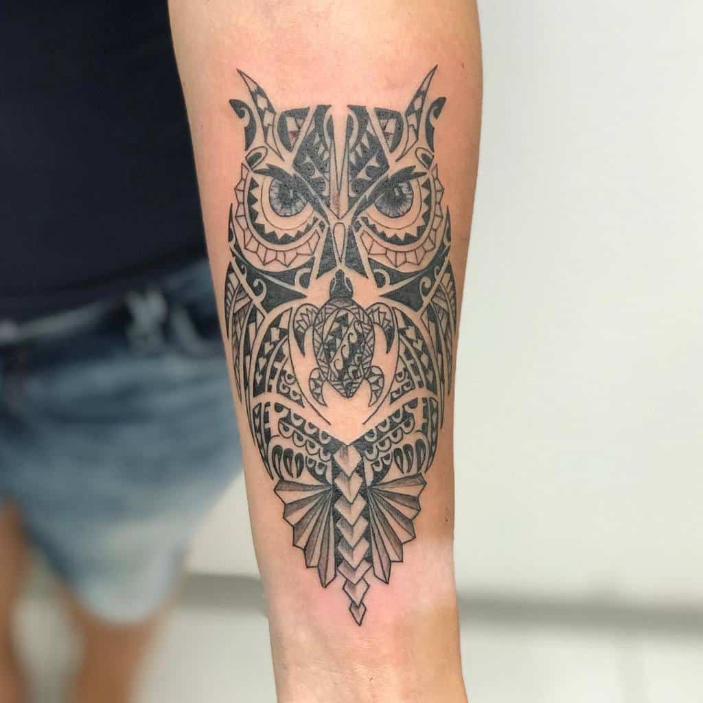Ornate owl tattoo on a person's forearm, featuring intricate geometric patterns with a hint of tribal design
