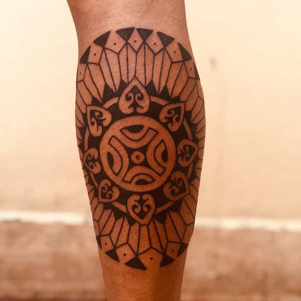 Tribal geometric tattoo with intricate patterns woven beautifully on a calf