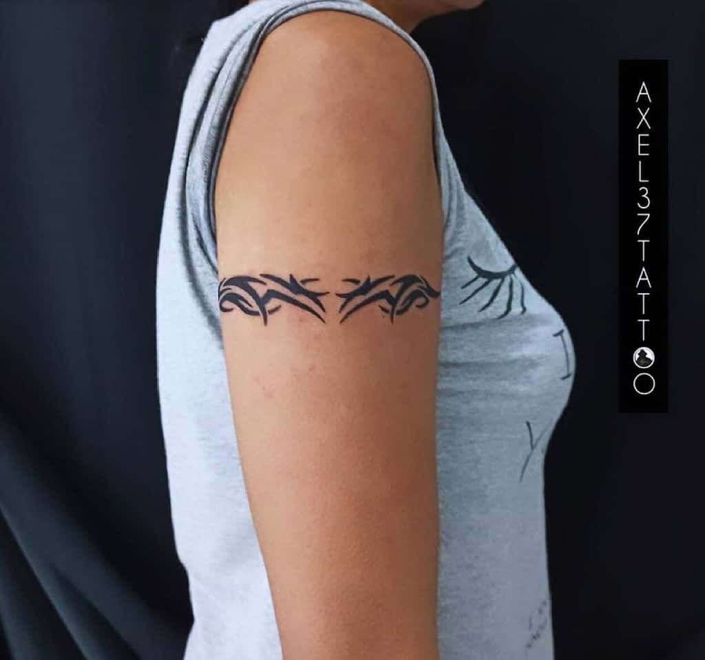 Upper arm with tribal armband tattoo