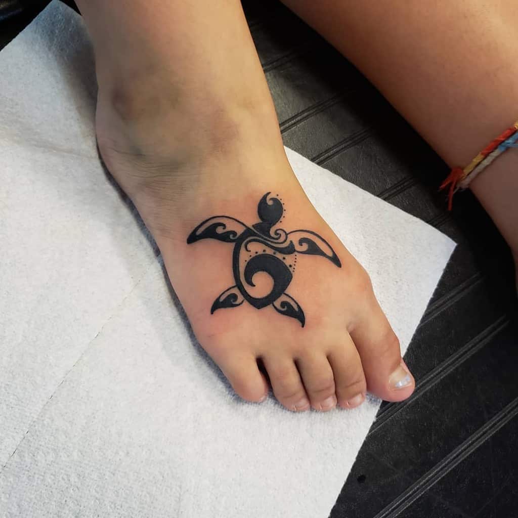 Tribal turtle tattoo on foot