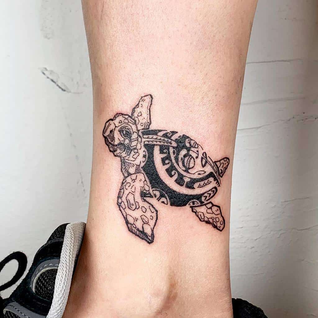 Tattoo of a detailed tribal sea turtle design on an ankle