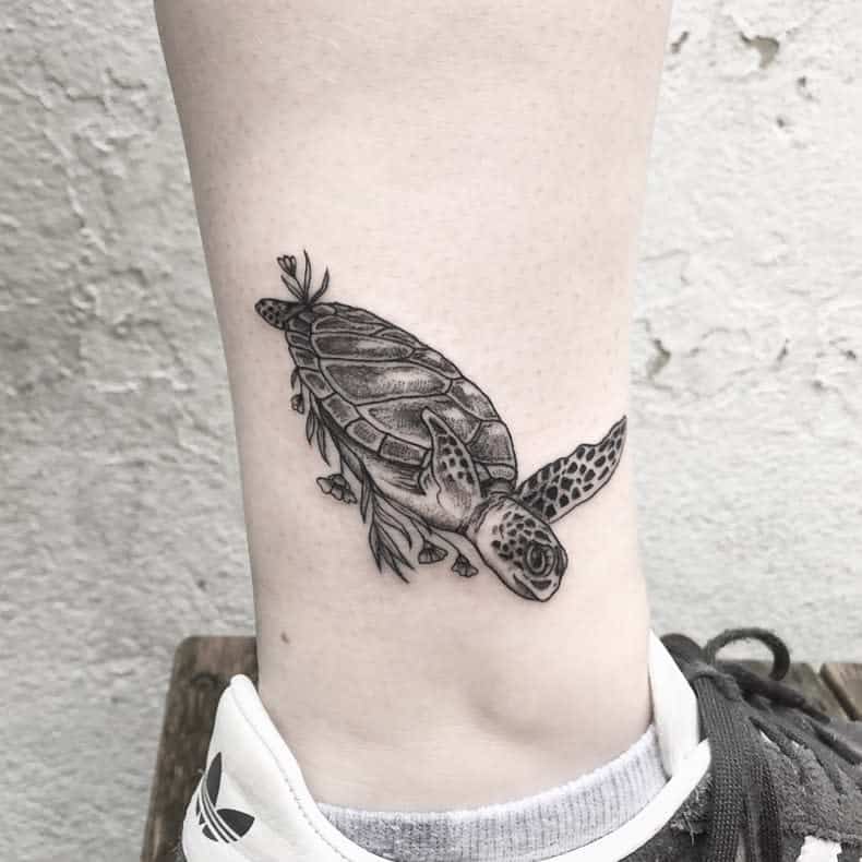 Black and white turtle tattoo on ankle