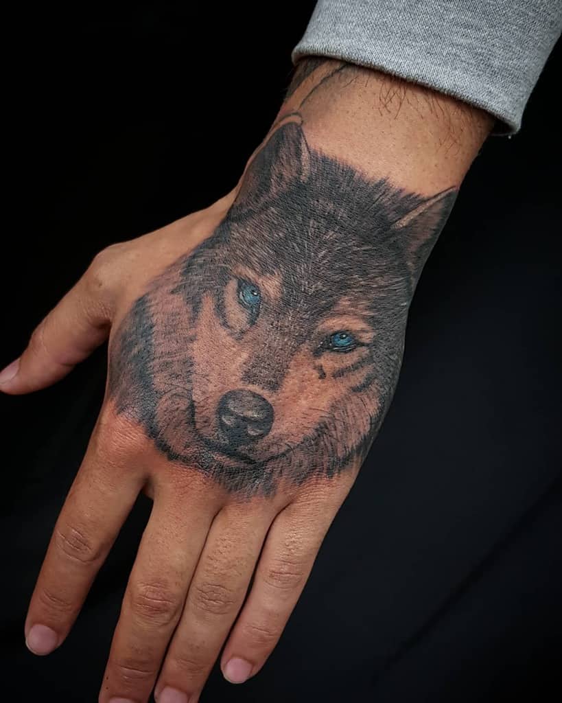 Small Wolf Hand Finger Tattoo tattooer_jije