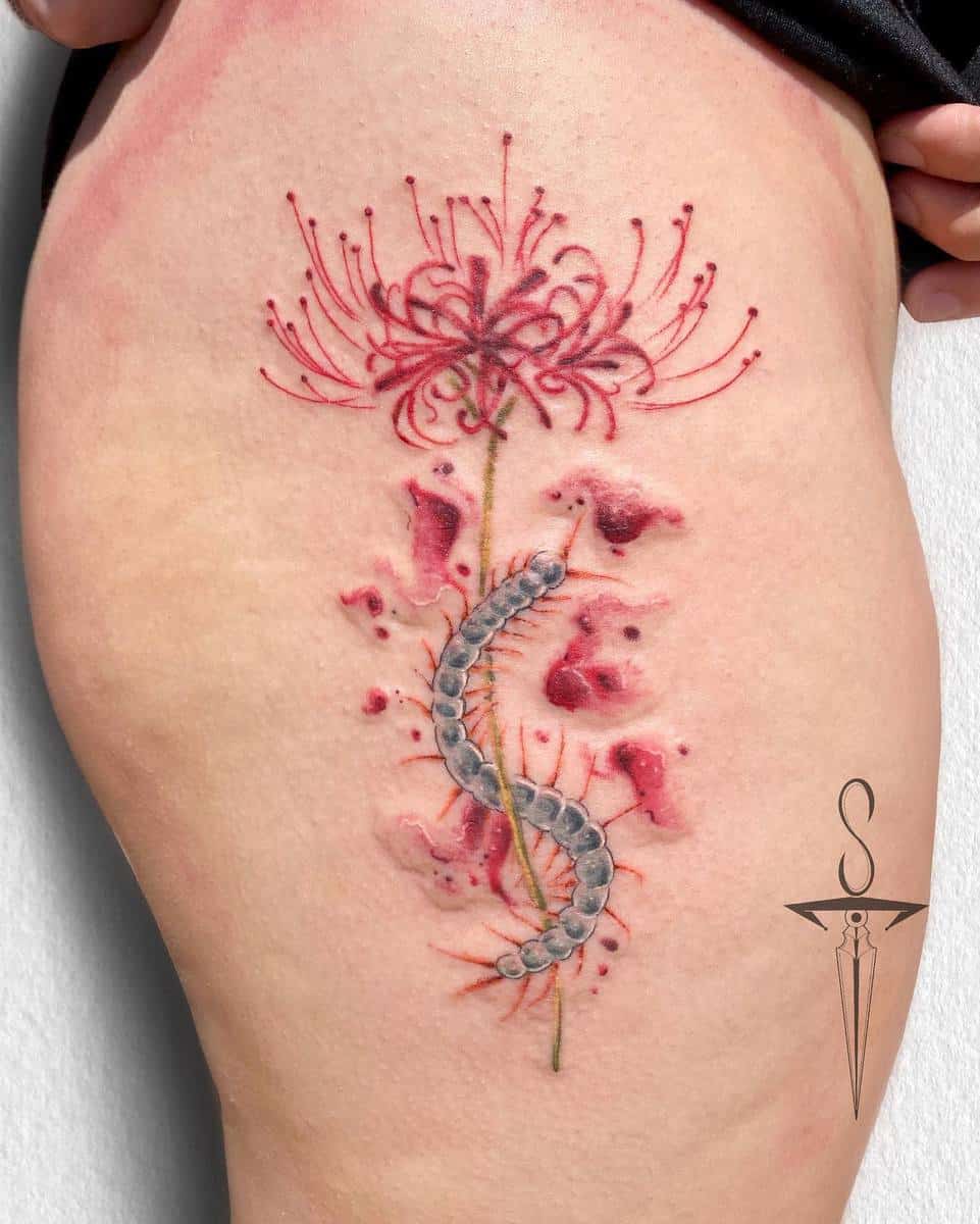 A tattoo of a red spider lily with a centipede, creating a striking and symbolic design