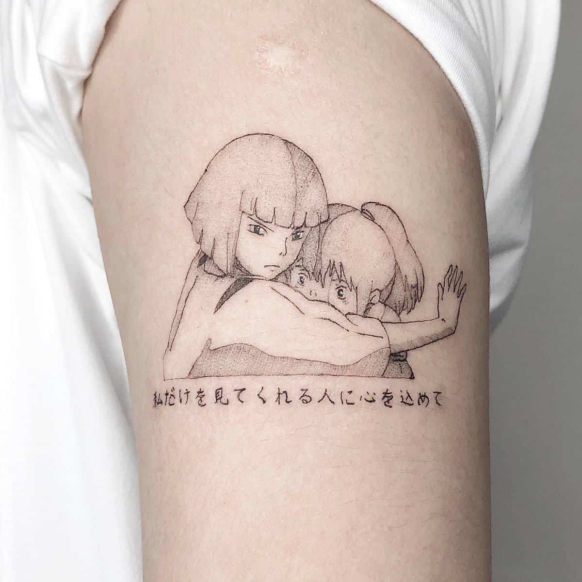 Minimalist tattoo of Haku protecting Chihiro from Spirited Away with Japanese text underneath on the upper arm