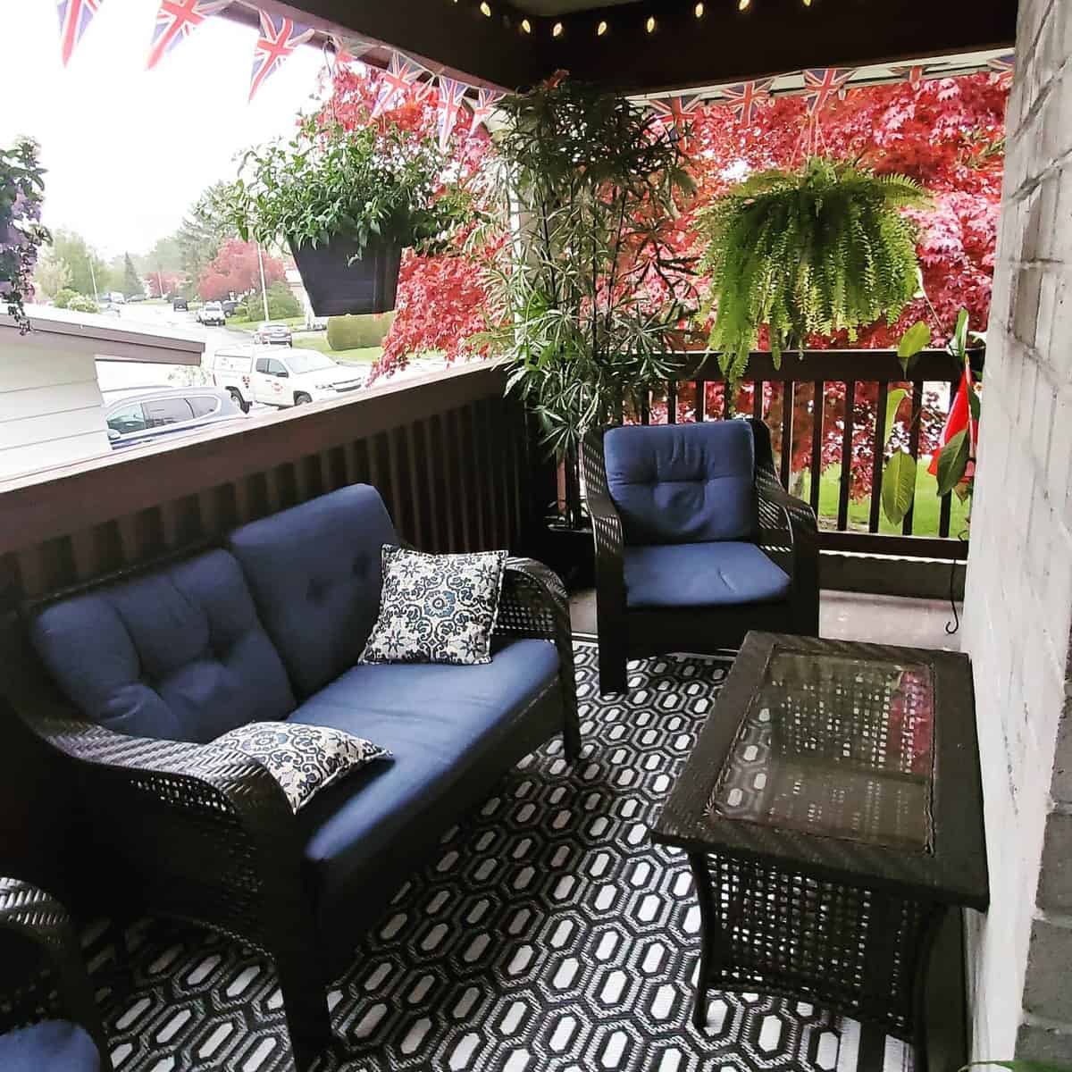 small slate deck with pattern rug and outdoor furniture
