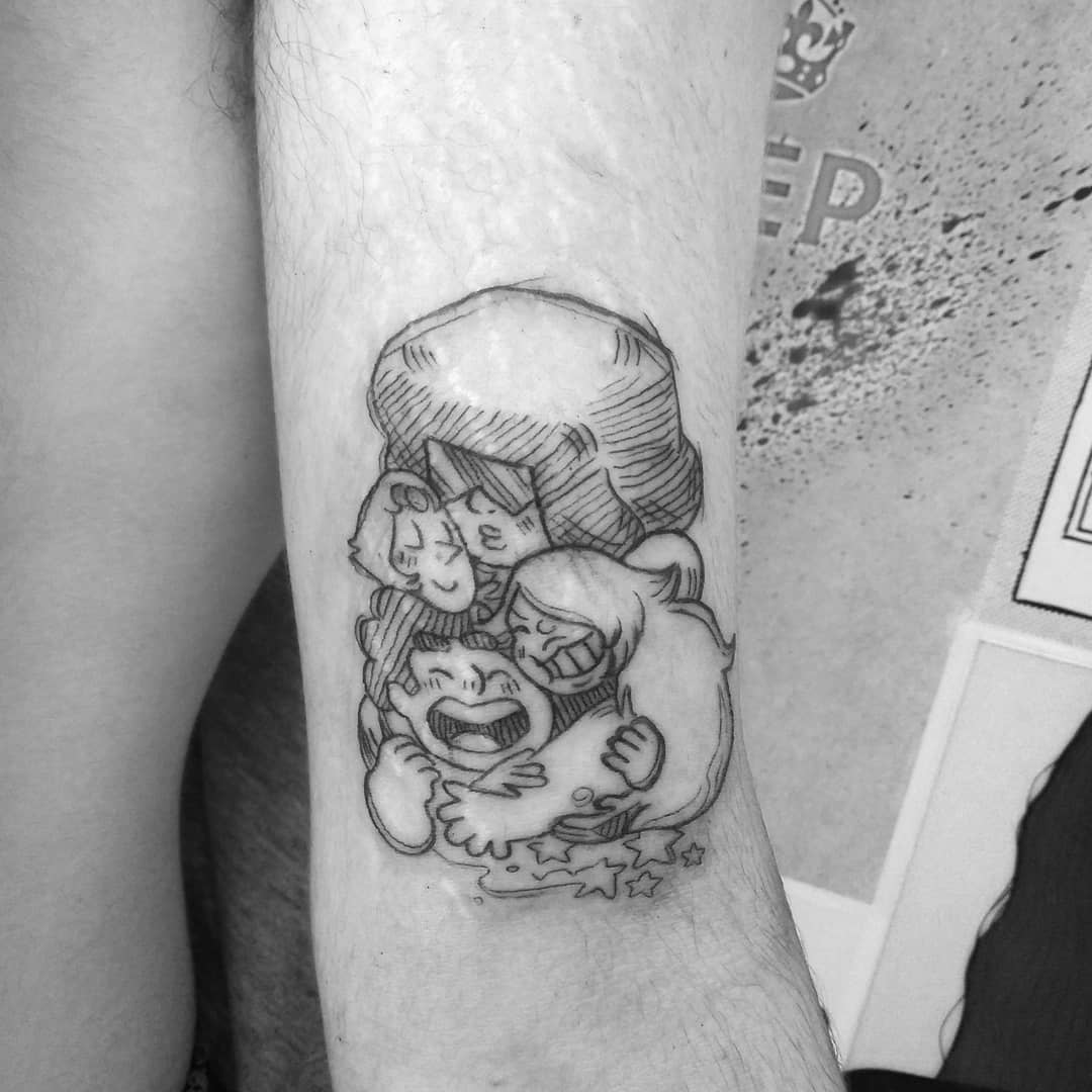 Black ink tattoo of Steven Universe characters hugging each other, featuring Steven, Garnet, Amethyst, and Pearl