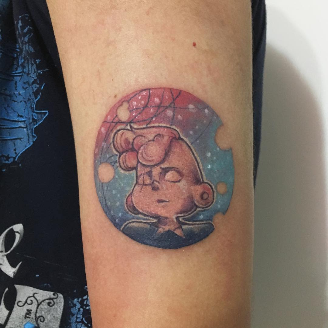 Colorful tattoo of Lars from Steven Universe with a cosmic background, featuring stars and planets