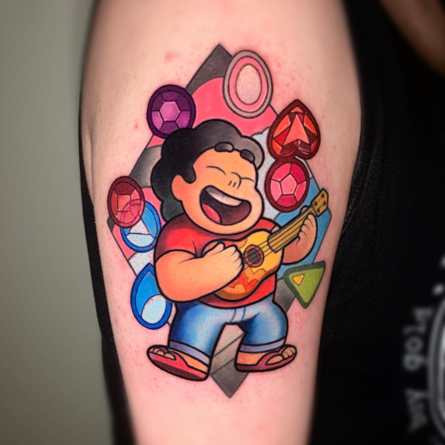 Steven Universe joyfully playing the ukulele surrounded by colorful gems and a vibrant background