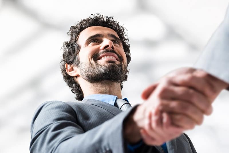 Success in selling is smiling and dialing- Successful businessman