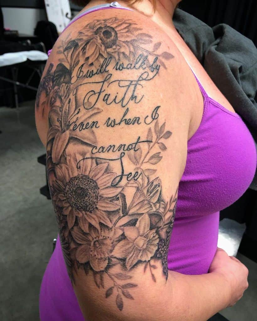 Arm tattoo featuring sunflowers and script text on a woman