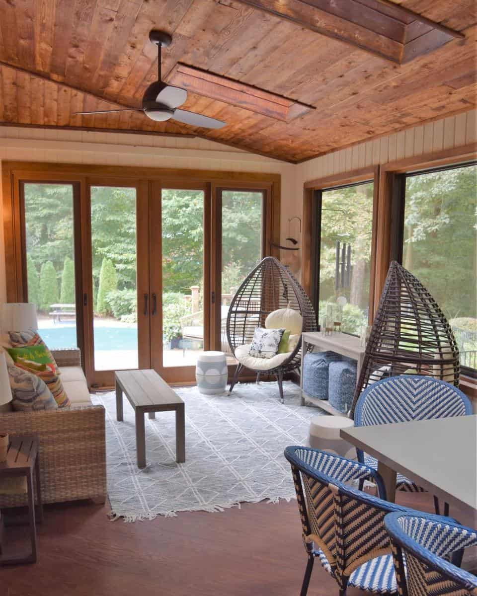 wood sunroom patio enclosure with egg seats
