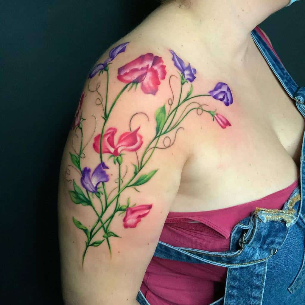 Floral tattoo on woman's shoulder and upper arm
