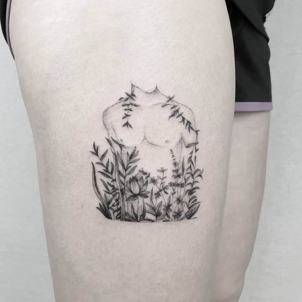Tattoo of a human torso and plants on a person's upper thigh intricately detailed with single needle precision