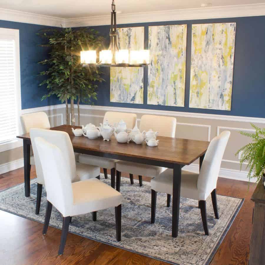 two tone blue and white wall dining room teapots chandelier canvas wall art dining room table and chairs 