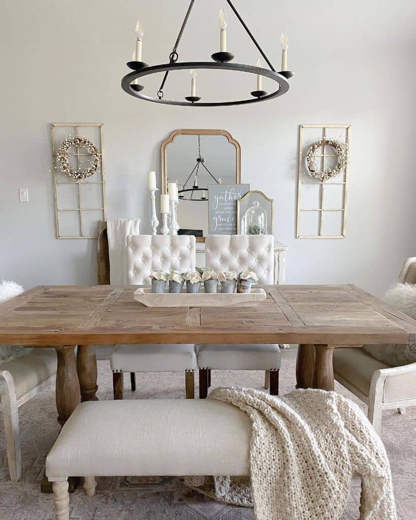 candle chandelier wood table white chairs wall mirror 