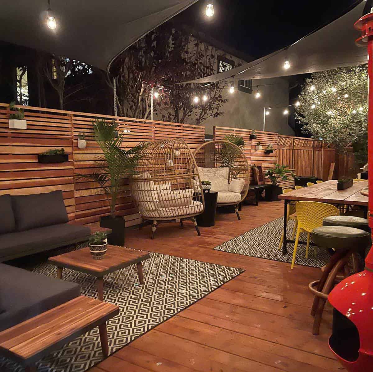 large tan deck wicker seats wood table shades