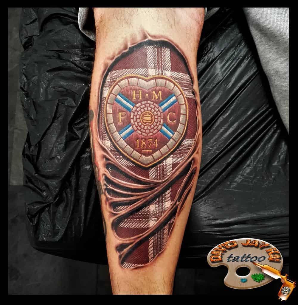 Scottish Tattoo with a 3D effect, featuring a plaid pattern and crest with "H" "M" "F" "C" and "1874" written on it