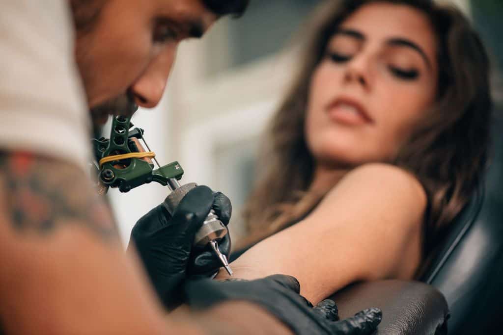 Tattoo Artist Working Left Arm Tattooing Woman