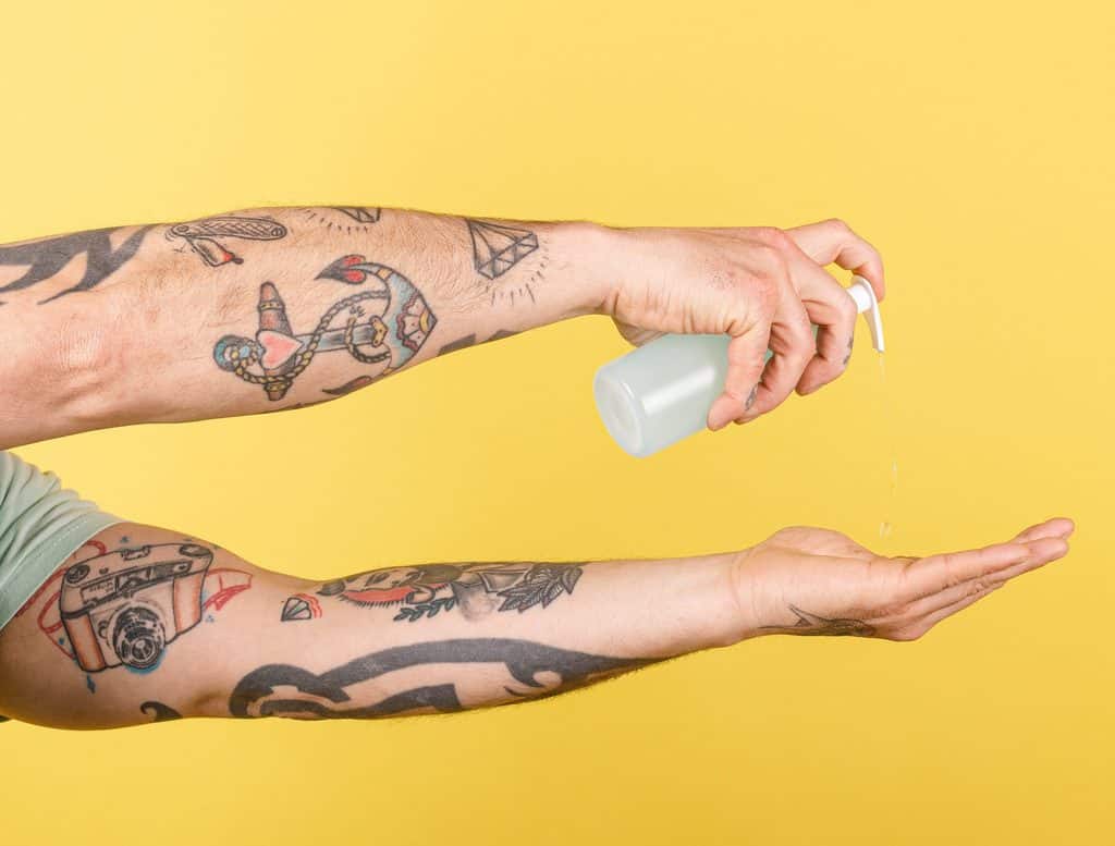 Tattooed Arms With Antibacterial Soap