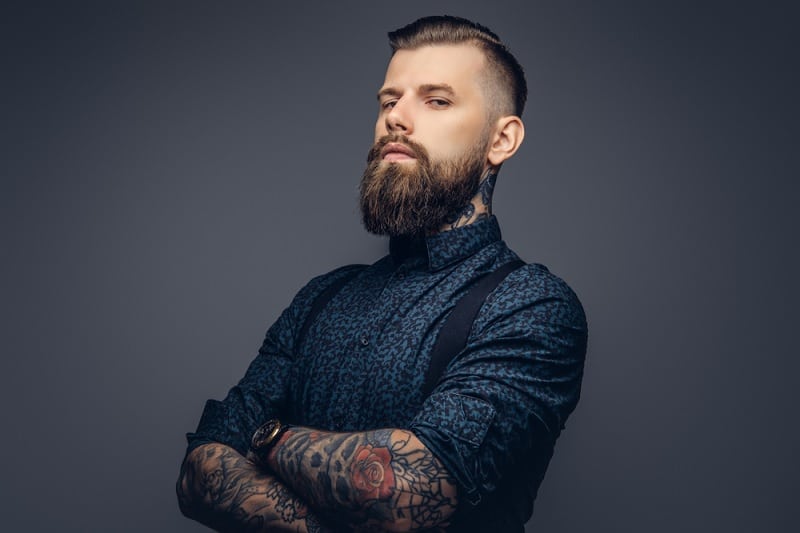 Tattooed Man With Ducktail Beard