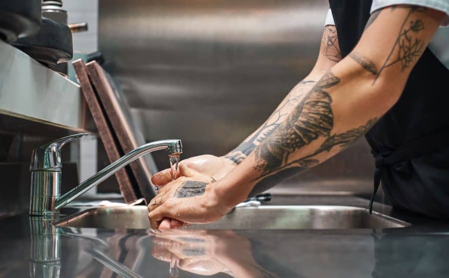 Tattooed Washing Hands