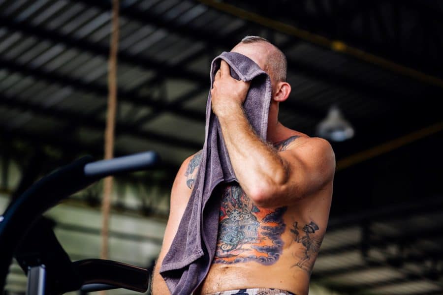 Tattooed_Man_Sweating_Towel