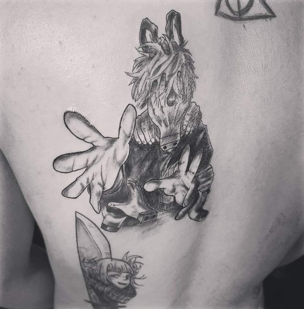 Black and grey tattoo of Tomura Shigaraki from My Hero Academia, featuring his eerie dismembered hand mask and outstretched grasping hands