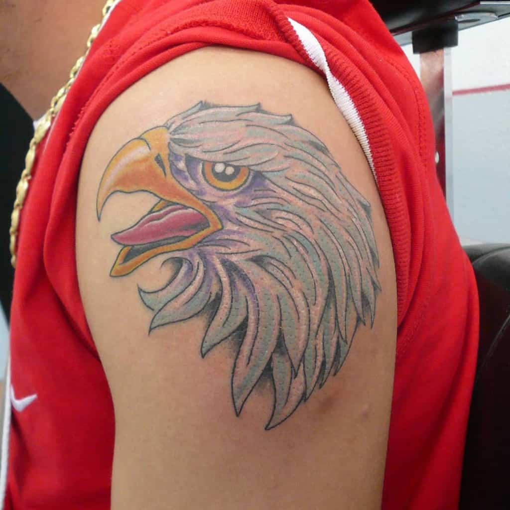 Eagle head tattoo on the upper arm