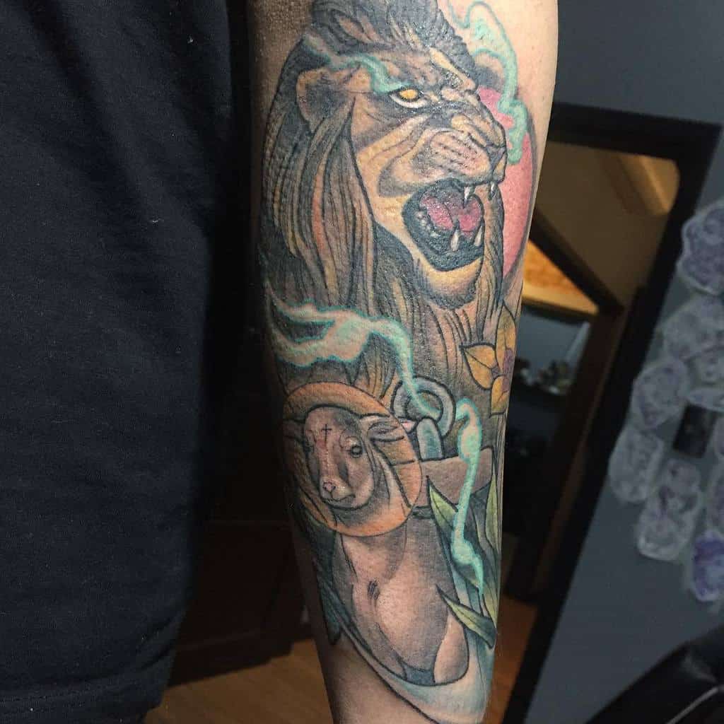 Tattoo of a roaring lion and a calm lamb on a person's forearm