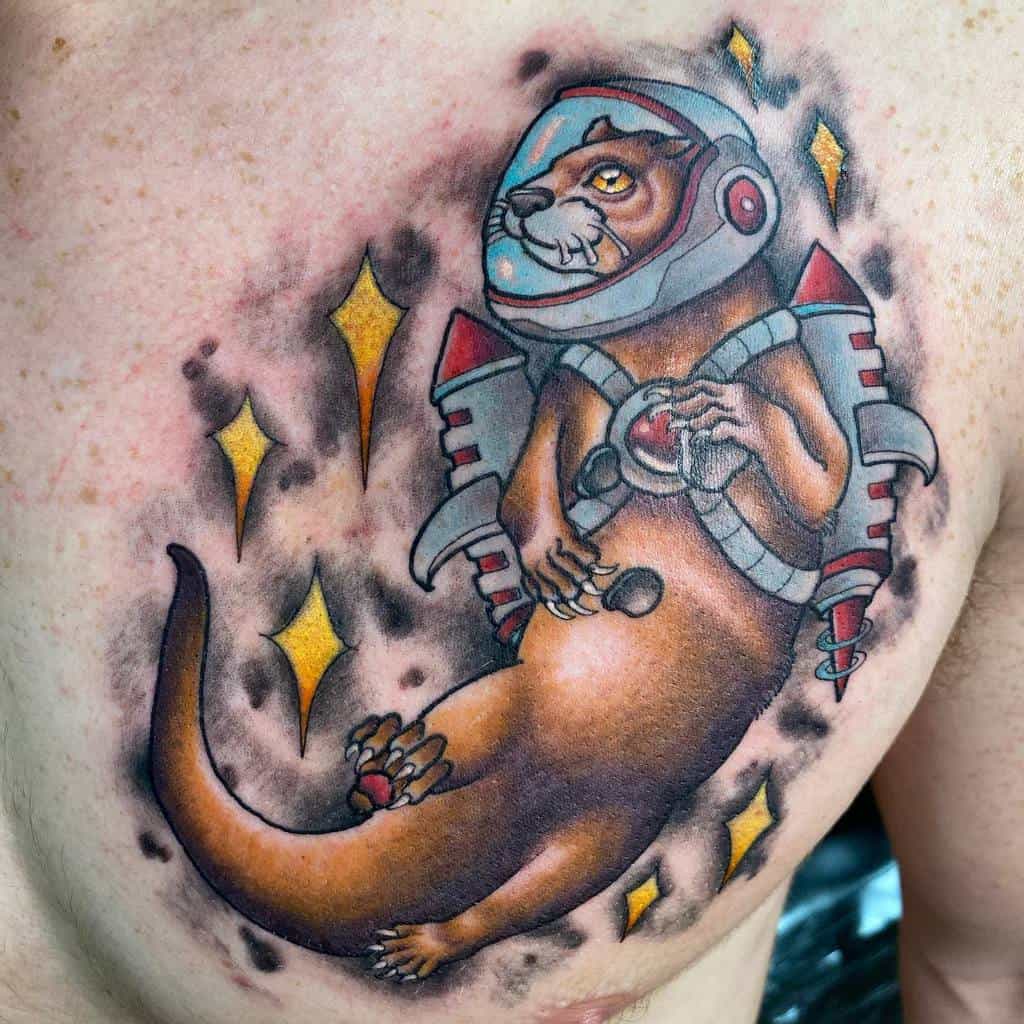 Tattoo of an otter in a space helmet with a jetpack and ray gun, surrounded by sparkles on a chest