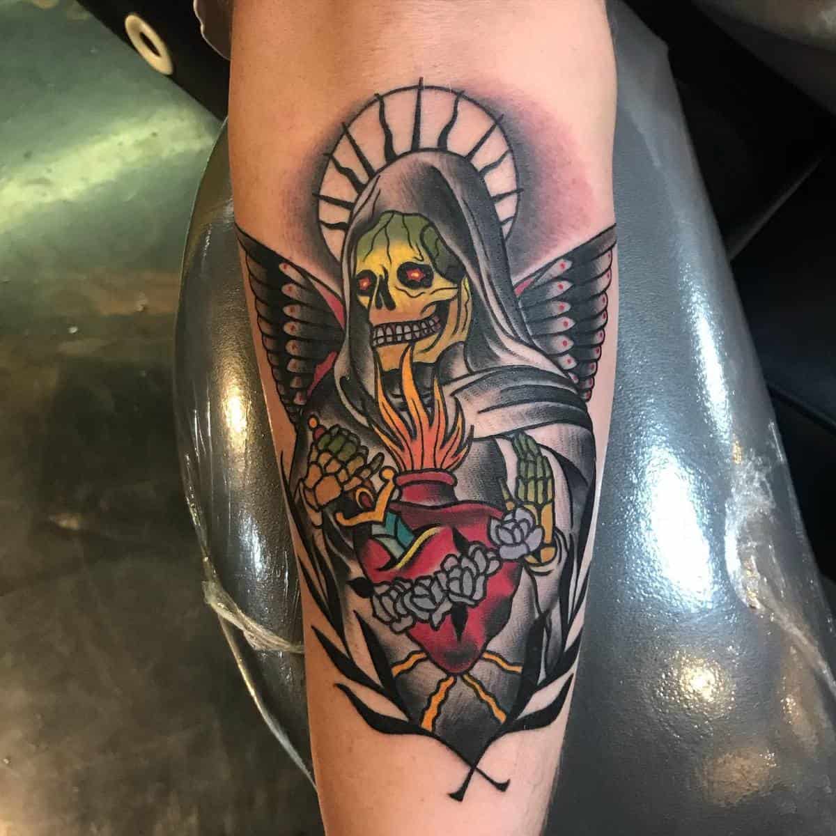 A vibrant Santa Muerte tattoo with glowing colors, featuring a sacred heart and floral details for a bold look