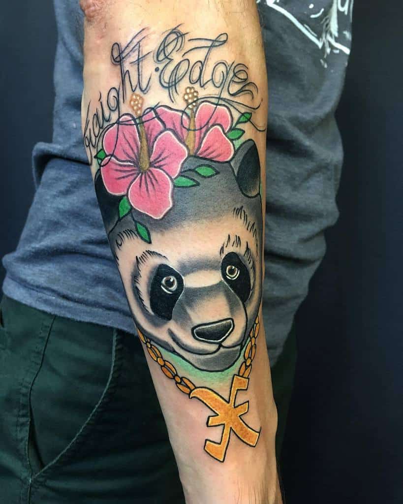 Colorful tattoo of a panda wearing a gold chain, surrounded by pink flowers and green leaves, and the words "Straight Edge" above it