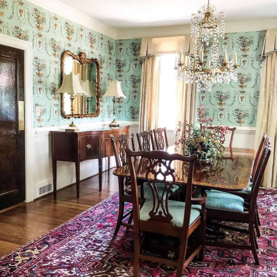 elaborate candle chandelier dining room table and chairs floral wallpaper pattern rug