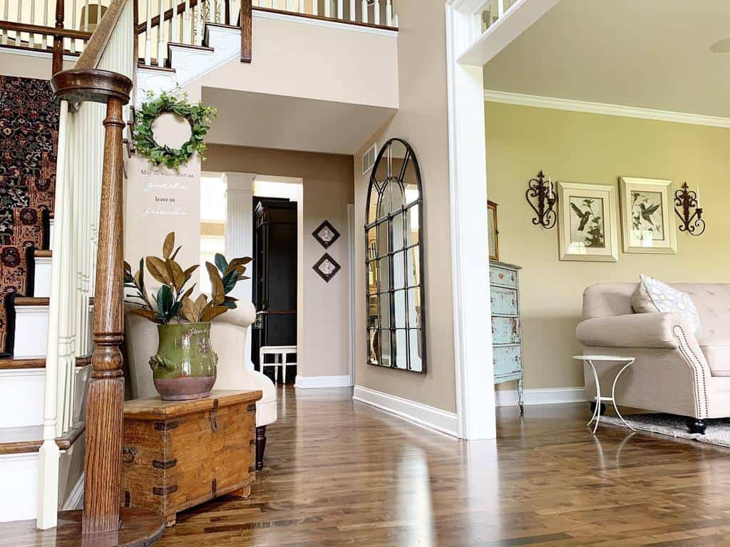 open home with green wall accent in living room