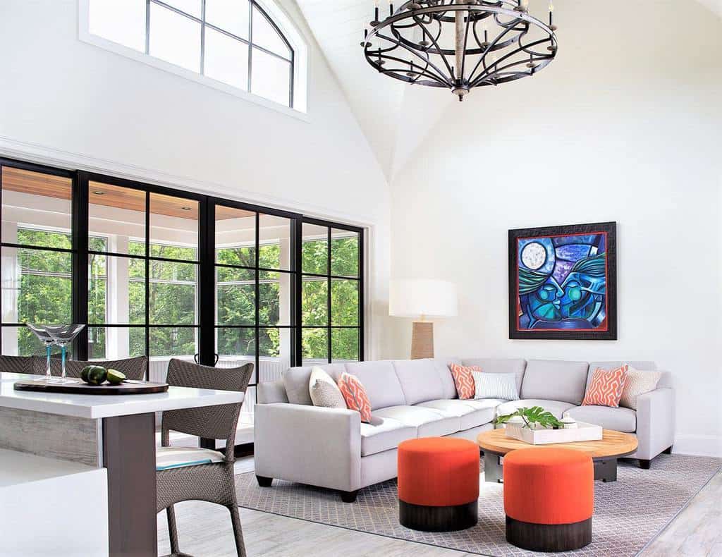 modern transitional living room with l-shape gray sofa and abstract wall art