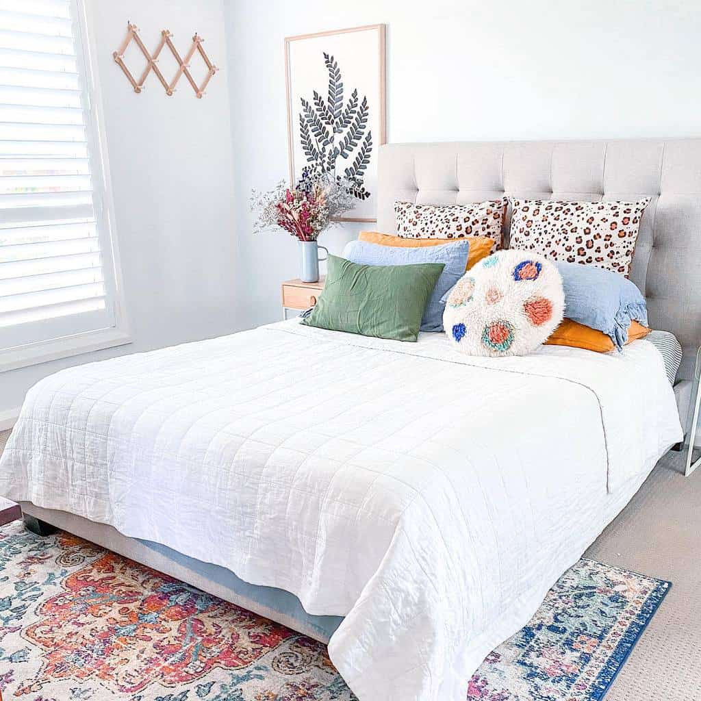 small simple master bedroom with pattern floor rug