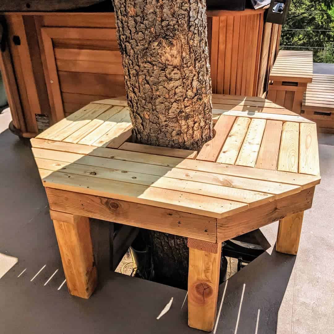 wood bench around tree spa patio