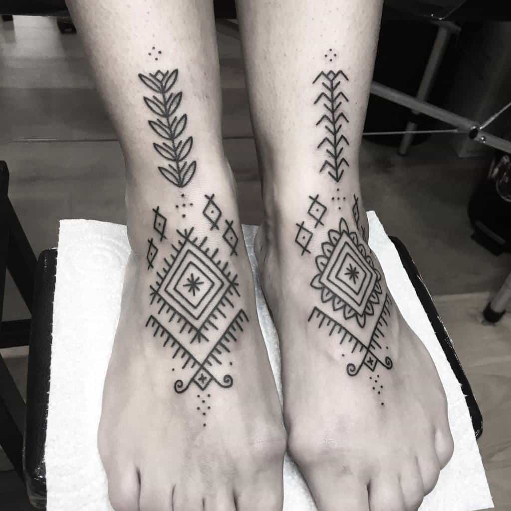 Geometric tribal tattoos on feet with diamond shapes and arrow motifs