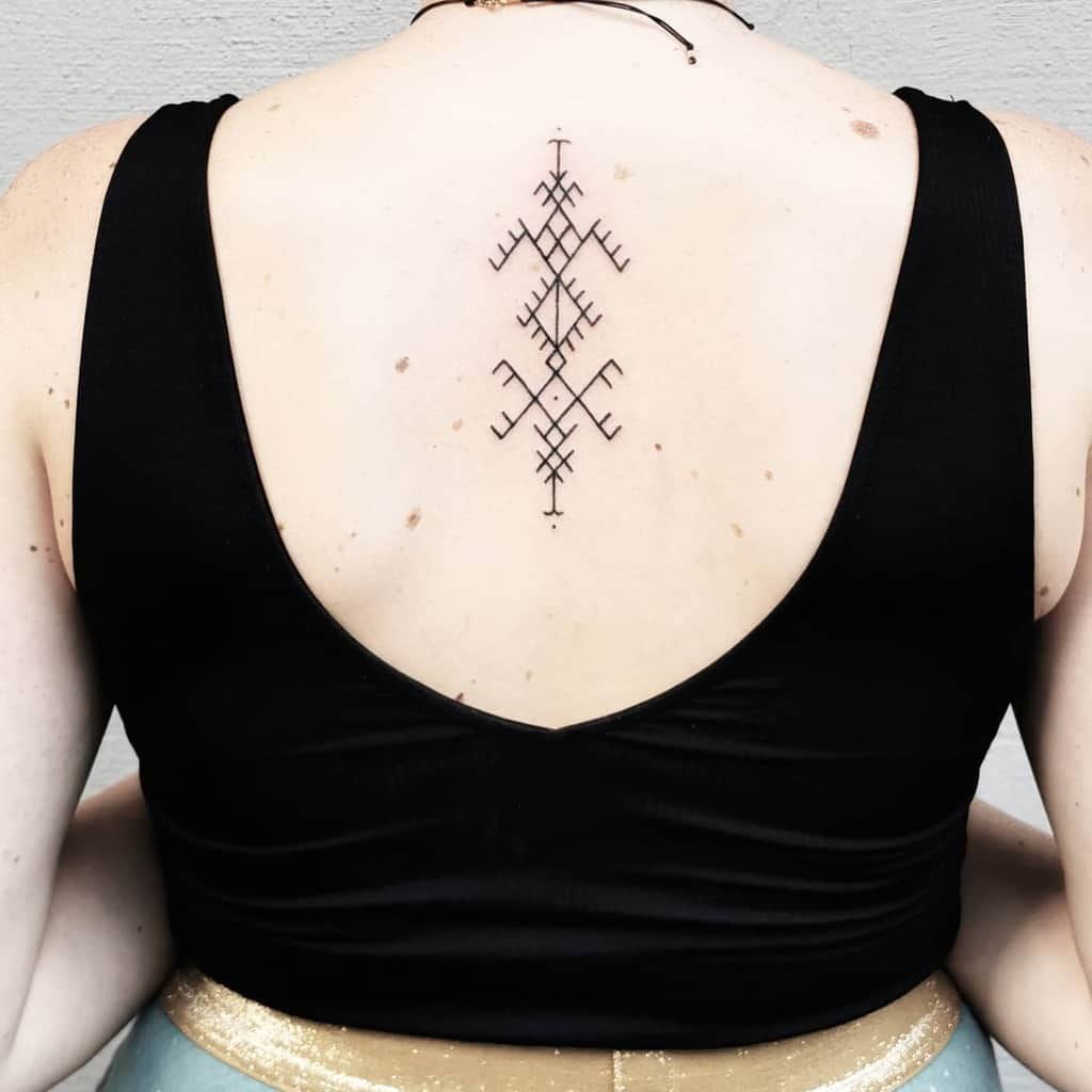 Woman with geometric tattoo on upper back