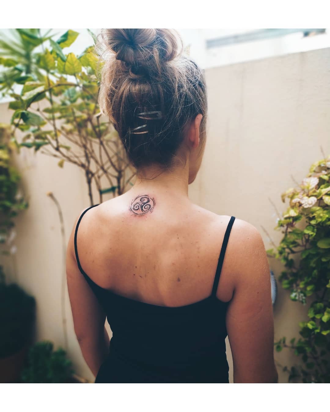 Triskelion Upper Back Black Tattoo Design