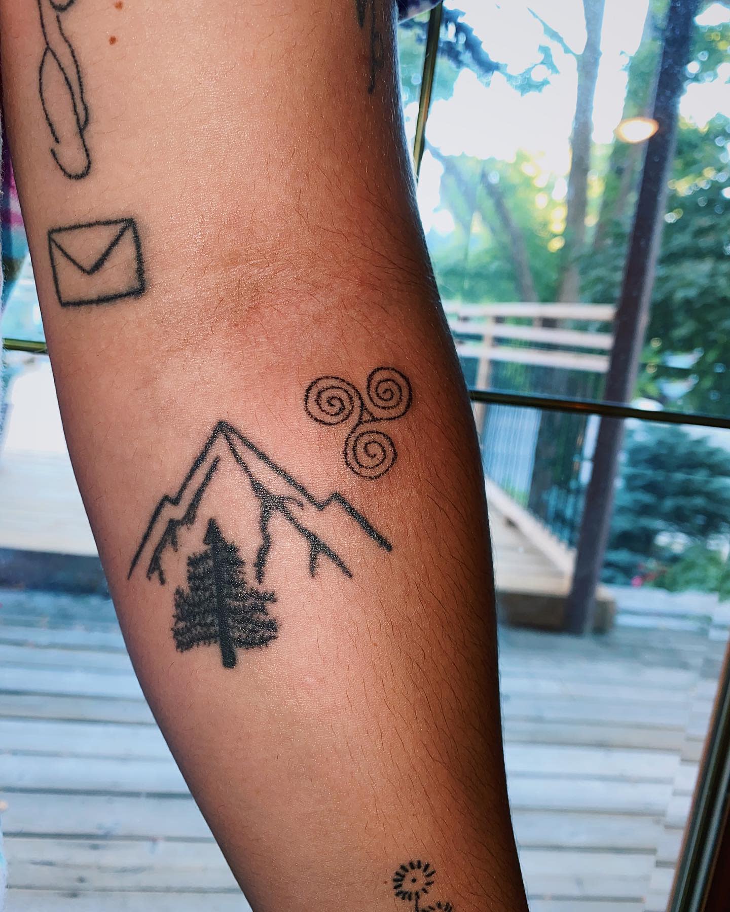 Small Triskelion Arm Tattoo