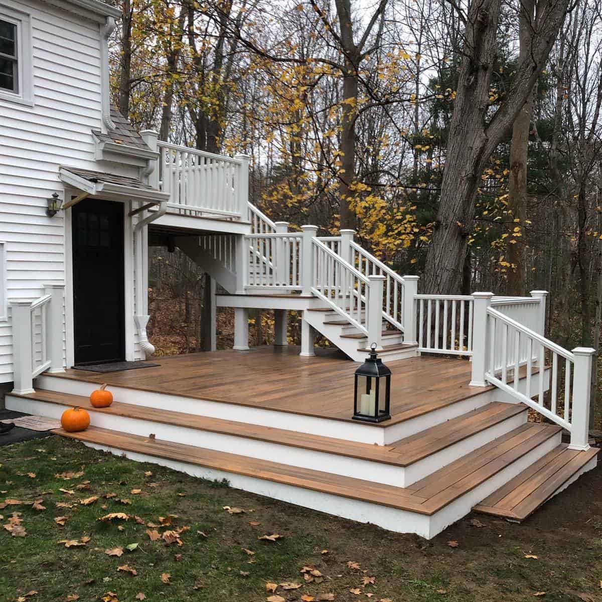 two-tone white and brown deck staircase pumpkins