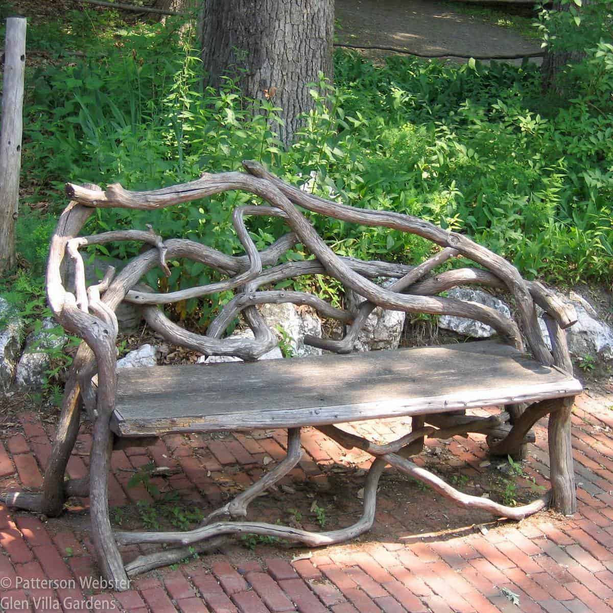 wood bench made from tree limbs