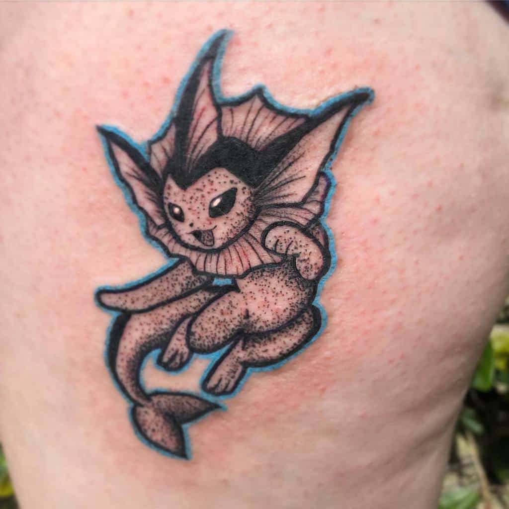 Bold Vaporeon tattoo with detailed stippling, sharp fins, and a dynamic pose surrounded by a soft blue outline
